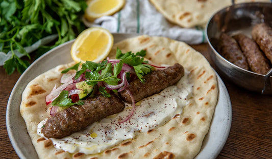 Halal free-range ground lamb kofta wraps in flatbread with garlic yogurt and herbs
