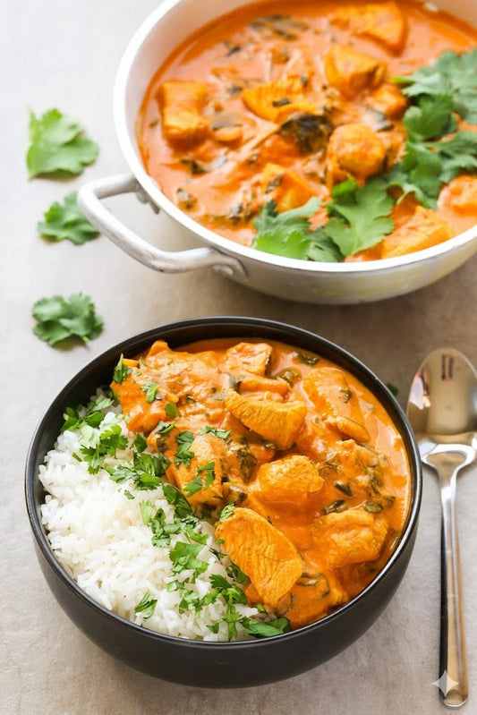 Halal coconut chicken curry simmered in a silky tomato sauce, served over rice