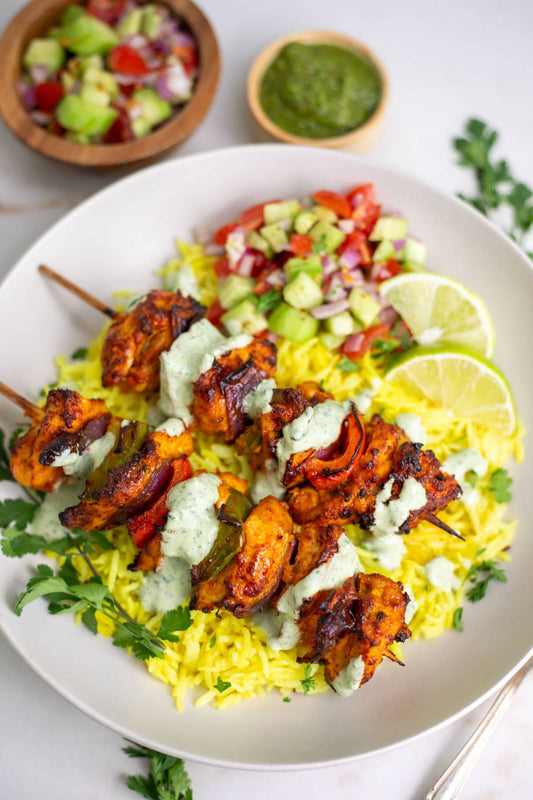 Halal chicken tikka skewers marinated in spiced yogurt and grilled, with mint chutney