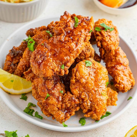 Crispy halal chicken tenders drizzled with a sweet and spicy hot honey glaze