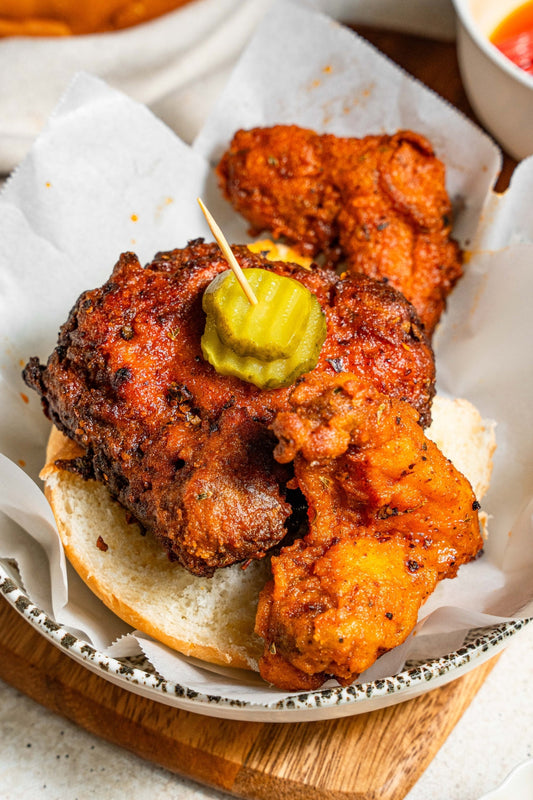 Halal double-battered fried chicken tenders finished with a fiery cayenne oil