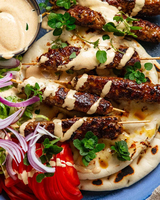Halal organic grass-fed beef kofta kebabs with tzatziki and flatbread
