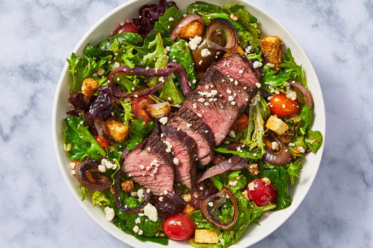 Halal grass-fed top sirloin steak salad with blue cheese and crispy fried onions