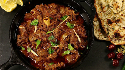 Halal bone-in goat karahi slow-cooked in a bold tomato masala