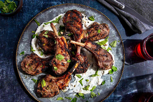 Herb-crusted halal lamb rib chops grilled to a char with mint yogurt sauce