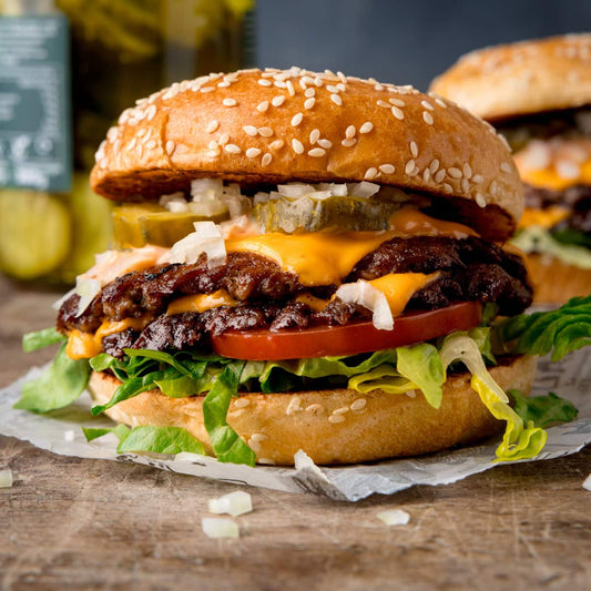 Halal organic grass-fed beef smash burgers with melted cheddar and garlic aioli