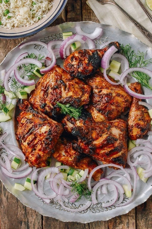 Halal whole chicken marinated in Kashmiri chili and grilled Pakistani chargha style