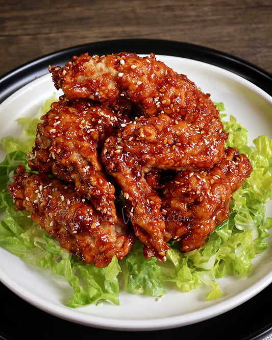 Halal Korean fried chicken wings double-fried and tossed in a sticky gochujang glaze