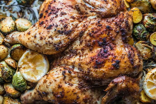 Halal whole chicken spatchcocked flat and roasted with preserved lemon and herbs
